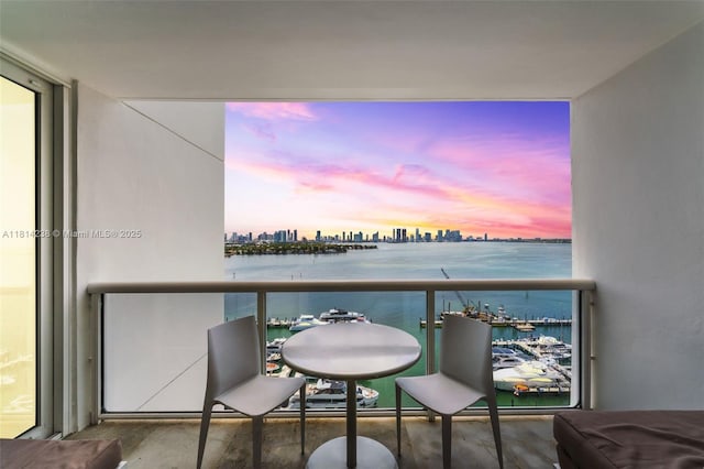 1900 Sunset Harbour Dr Unit 1814, Miami Beach, FL 33139 - balcony at dusk featuring a water view and a city view
