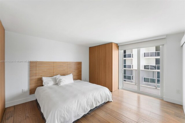 1900 Sunset Harbour Dr Unit 1814, Miami Beach, FL 33139 - bedroom featuring access to exterior and wood finished floors