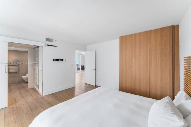 1900 Sunset Harbour Dr Unit 1814, Miami Beach, FL 33139 - bedroom featuring light wood-style flooring and ensuite bathroom