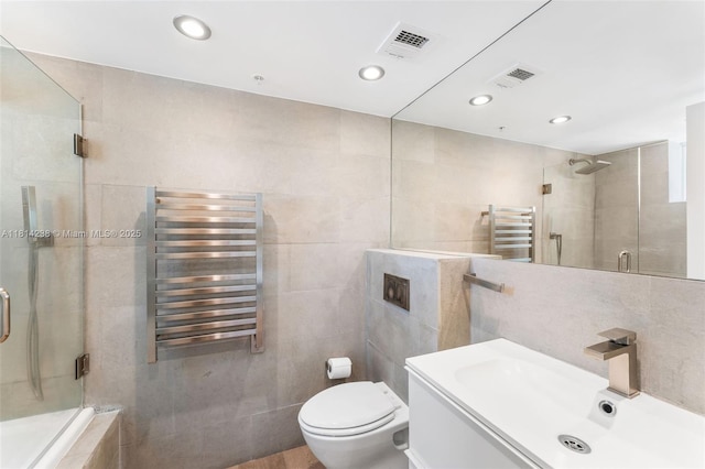 1900 Sunset Harbour Dr Unit 1814, Miami Beach, FL 33139 - full bathroom featuring radiator, a towel warming rack, a shower stall, vanity, and tile walls