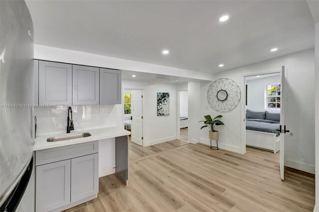 920 SW 8th Ct, Miami, FL 33130 - kitchen featuring gray cabinets, light wood finished floors, light countertops, healthy amount of natural light, and recessed lighting