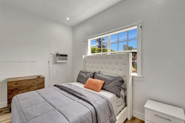 920 SW 8th Ct, Miami, FL 33130 - bedroom featuring light wood-type flooring and a wall mounted AC