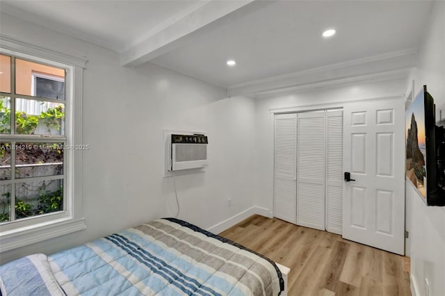 920 SW 8th Ct, Miami, FL 33130 - bedroom featuring light wood-style flooring, beam ceiling, recessed lighting, an AC wall unit, and a closet