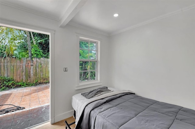 920 SW 8th Ct, Miami, FL 33130 - bedroom featuring beam ceiling, light wood finished floors, multiple windows, and crown molding