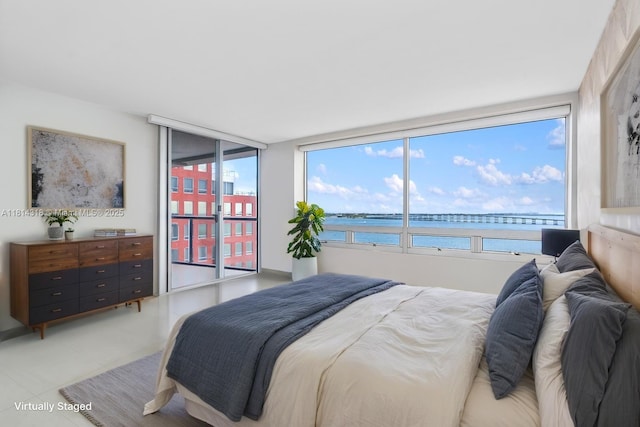 1541 Brickell Ave Unit A1202, Miami, FL 33129 - bedroom with a water view and light tile patterned floors