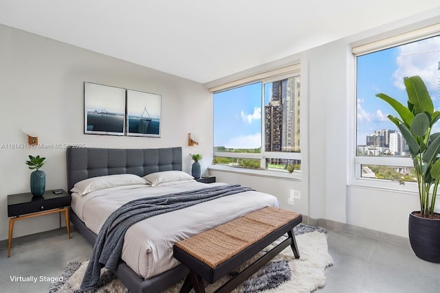 1541 Brickell Ave Unit A1202, Miami, FL 33129 - bedroom with finished concrete floors and baseboards