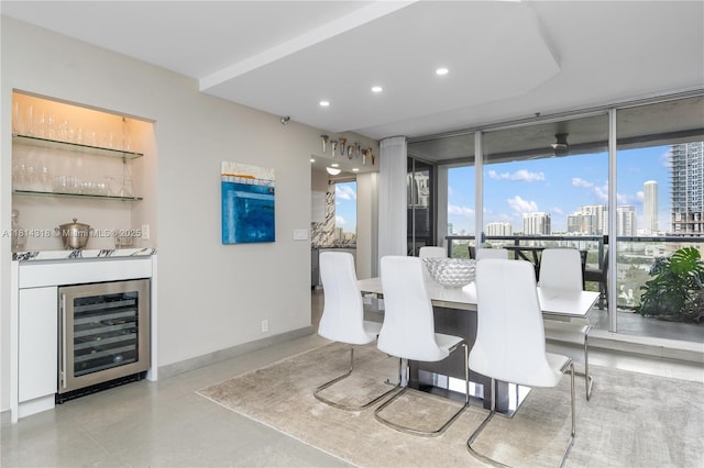 1541 Brickell Ave Unit A1202, Miami, FL 33129 - dining area with beverage cooler, a bar, a view of city, baseboards, and floor to ceiling windows
