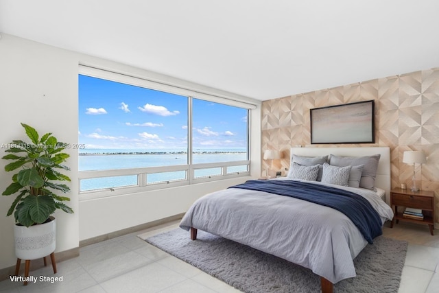 1541 Brickell Ave Unit A1202, Miami, FL 33129 - bedroom with a water view, baseboards, and light tile patterned flooring
