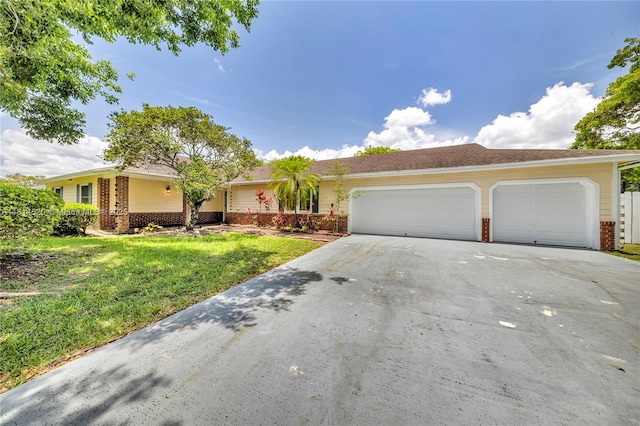 14630 SW 147th Ct, Miami, FL 33196 - ranch-style house featuring brick siding, driveway, an attached garage, and a front lawn