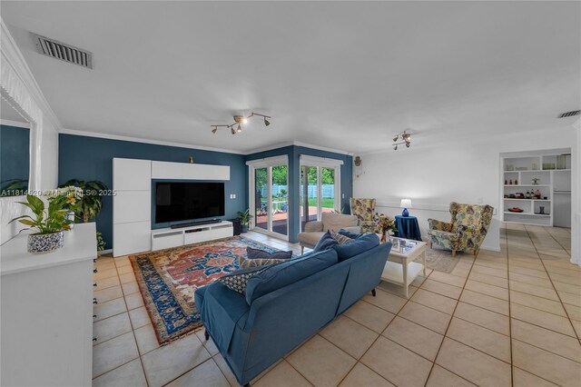 14630 SW 147th Ct, Miami, FL 33196 - living area featuring light tile patterned floors and ornamental molding
