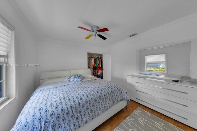 14630 SW 147th Ct, Miami, FL 33196 - bedroom featuring ceiling fan, wood finished floors, a closet, and crown molding