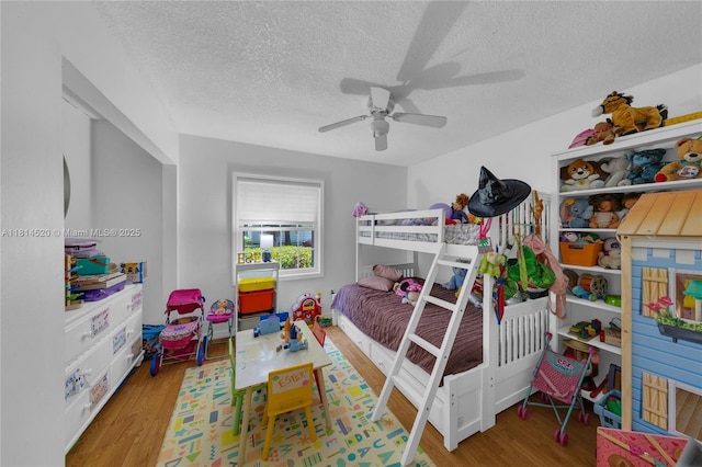 14630 SW 147th Ct, Miami, FL 33196 - bedroom with wood finished floors, a textured ceiling, and a ceiling fan