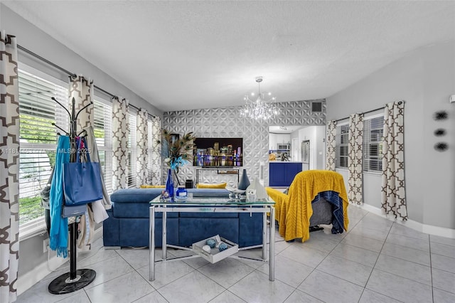 15240 SW 188th St, Miami, FL 33187 - living room featuring wallpapered walls, a chandelier, healthy amount of natural light, light tile patterned flooring, and a textured ceiling