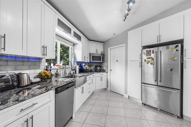 15240 SW 188th St, Miami, FL 33187 - dining area with light tile patterned floors and a textured ceiling