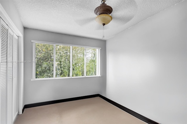 15240 SW 188th St, Miami, FL 33187 - unfurnished bedroom featuring a closet, a textured ceiling, and a ceiling fan