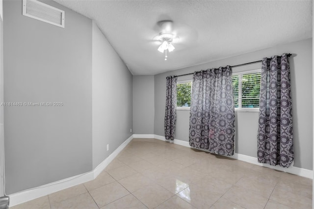 15240 SW 188th St, Miami, FL 33187 - unfurnished room featuring a textured ceiling and light tile patterned floors