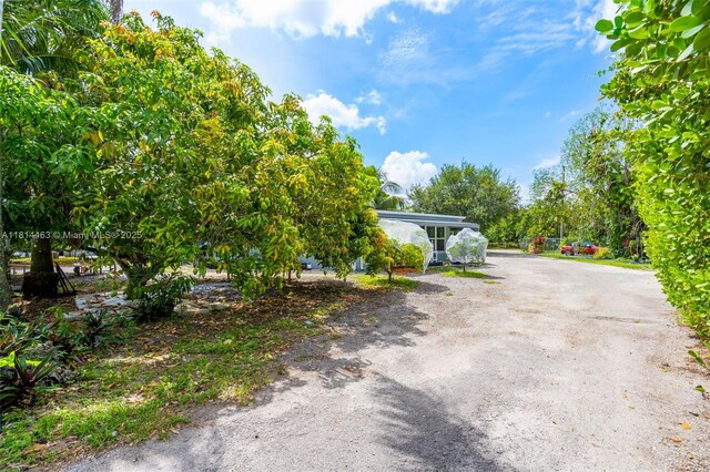15240 SW 188th St, Miami, FL 33187 - exterior space featuring dirt driveway