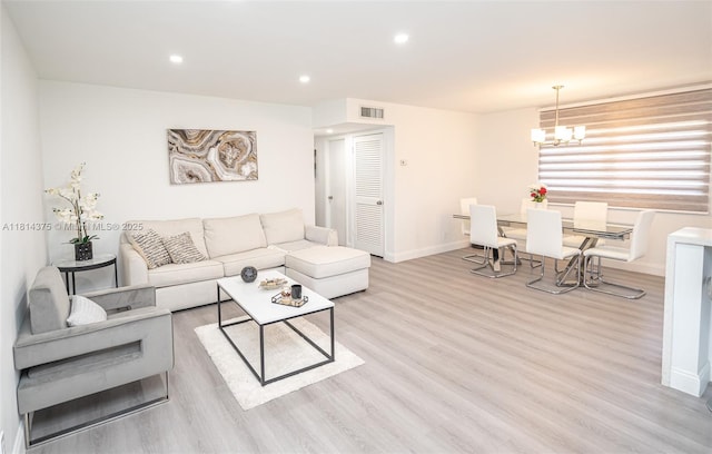 5300 Washington St Unit T227, Hollywood, FL 33021 - living room featuring light wood-style floors, baseboards, a chandelier, and recessed lighting