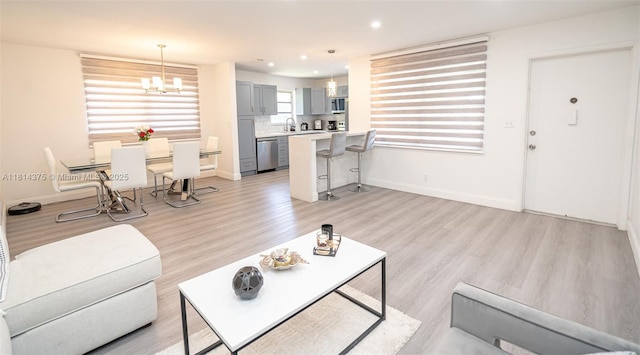 5300 Washington St Unit T227, Hollywood, FL 33021 - living area with light wood-style floors, baseboards, a chandelier, and recessed lighting