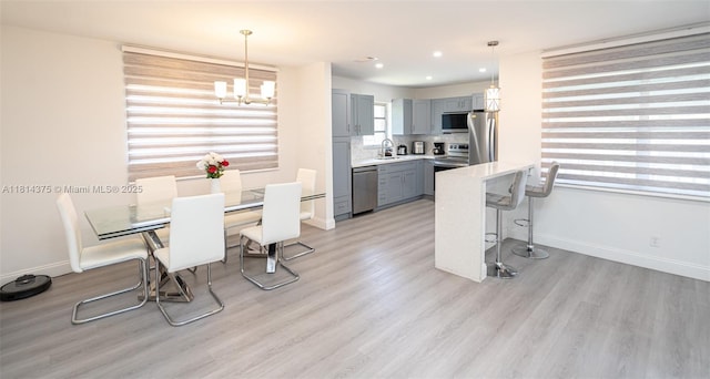 5300 Washington St Unit T227, Hollywood, FL 33021 - dining space with light wood-style floors, a chandelier, baseboards, and recessed lighting