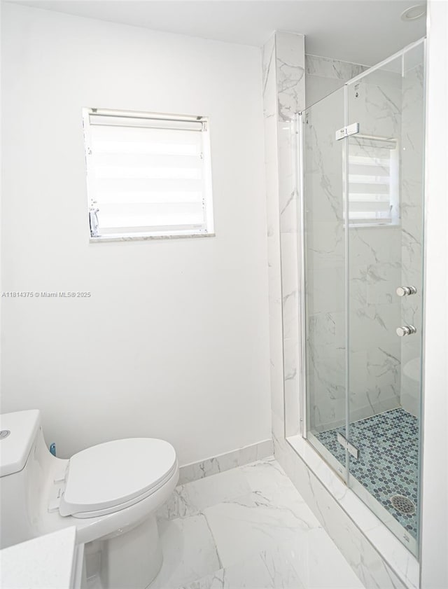 5300 Washington St Unit T227, Hollywood, FL 33021 - bathroom featuring toilet, a marble finish shower, marble look tiles, and baseboards