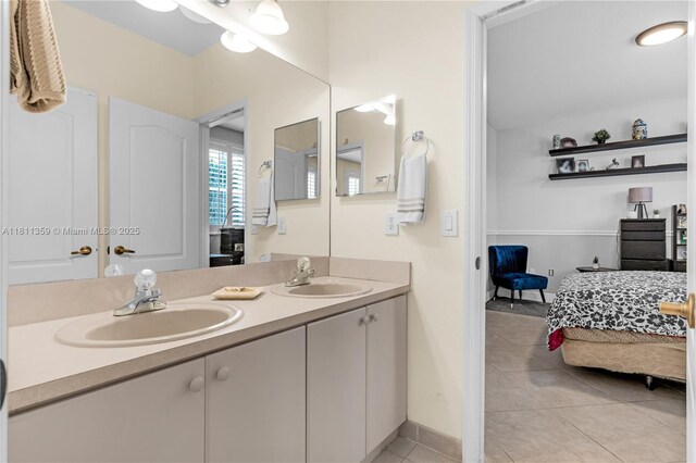 8753 SW 3rd Ln, Miami, FL 33174 - bathroom with double vanity, tile patterned flooring, connected bathroom, and baseboards
