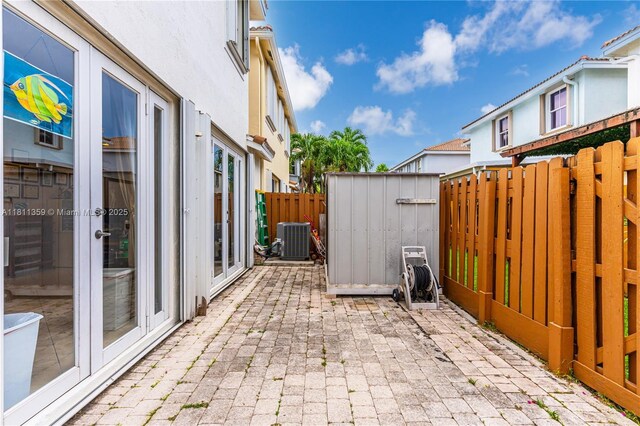 8753 SW 3rd Ln, Miami, FL 33174 - view of patio with central AC unit and french doors