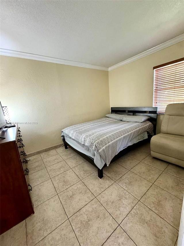 4050 NW 135th St Unit 15-11, Opa-Locka, FL 33054 - bedroom with crown molding, light tile patterned floors, and baseboards