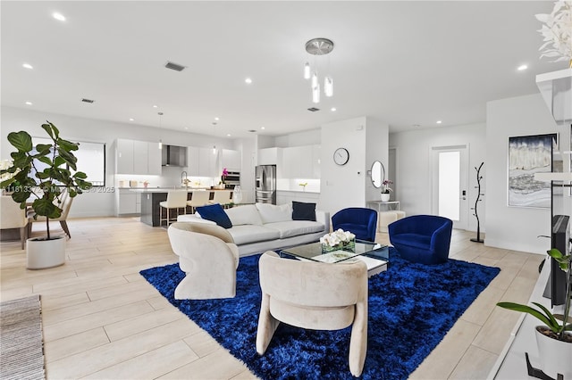 4381 SW 178th Ave, Miramar, FL 33029 - living area featuring wood tiled floors and recessed lighting