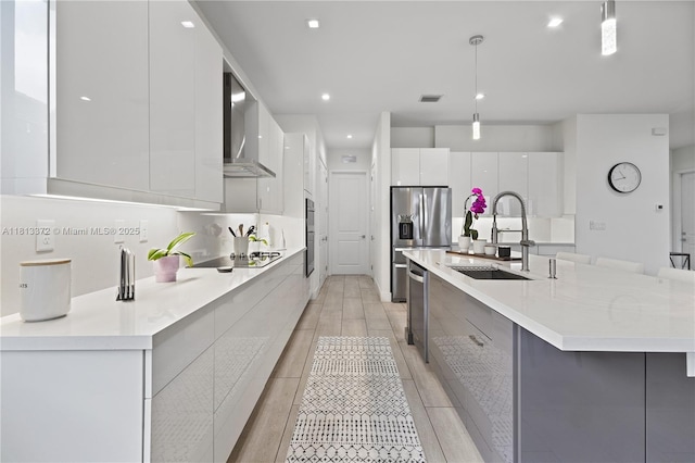 4381 SW 178th Ave, Miramar, FL 33029 - kitchen with modern cabinets, a sink, wall chimney exhaust hood, white cabinets, and hanging light fixtures