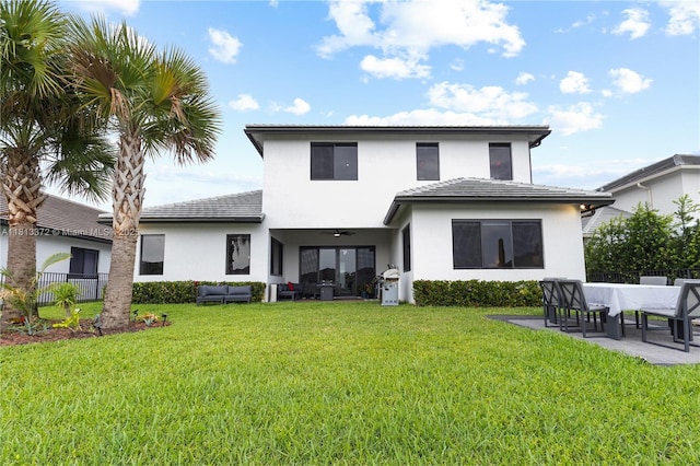4381 SW 178th Ave, Miramar, FL 33029 - back of property with an outdoor hangout area, a patio area, stucco siding, a ceiling fan, and a tiled roof
