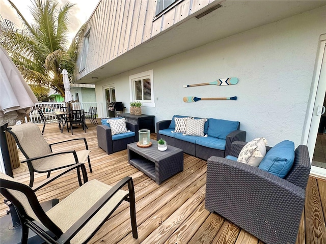 1370 NE 40th Dr, Oakland Park, FL 33334 - wooden terrace featuring an outdoor living space, outdoor dining space, and a grill