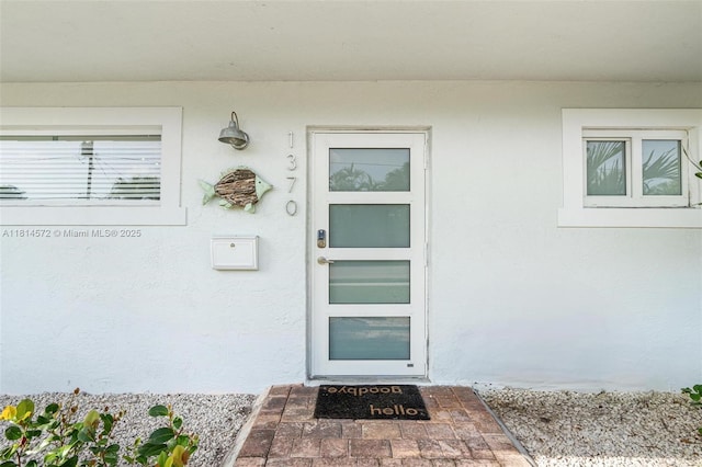 1370 NE 40th Dr, Oakland Park, FL 33334 - doorway to property featuring stucco siding