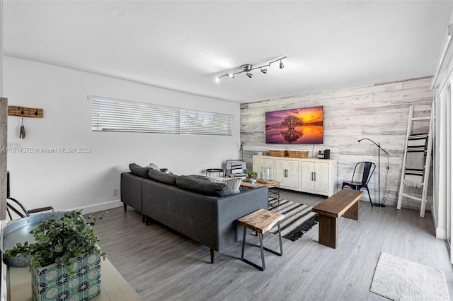 1370 NE 40th Dr, Oakland Park, FL 33334 - living room featuring an accent wall, wood finished floors, and wooden walls