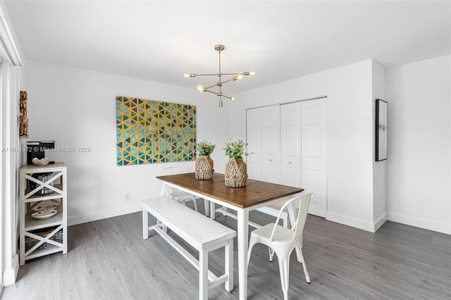 1370 NE 40th Dr, Oakland Park, FL 33334 - dining space with wood finished floors and a chandelier