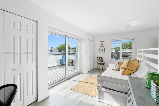 1370 NE 40th Dr, Oakland Park, FL 33334 - living area with healthy amount of natural light and light wood-style floors