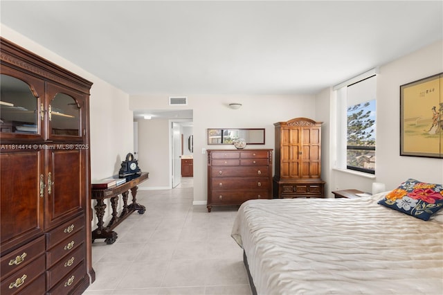 5845 Collins Ave Unit 501, Miami Beach, FL 33140 - bedroom with light tile patterned floors and baseboards