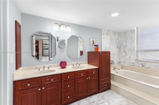 5845 Collins Ave Unit 501, Miami Beach, FL 33140 - full bathroom featuring a bath, double vanity, and marble finish flooring