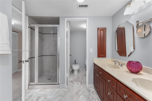 5845 Collins Ave Unit 501, Miami Beach, FL 33140 - bathroom with a bidet, a shower stall, double vanity, and baseboards