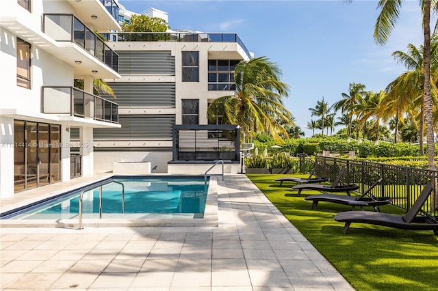 5845 Collins Ave Unit 501, Miami Beach, FL 33140 - view of swimming pool featuring a yard and a patio area