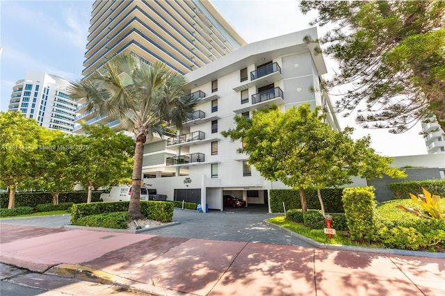 5845 Collins Ave Unit 501, Miami Beach, FL 33140 - view of apartment building / complex featuring a carport