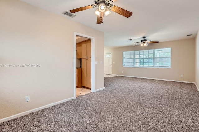 9802 N Military Trl, Palm Beach Gardens, FL 33410 - spare room featuring ceiling fan, light colored carpet, and baseboards