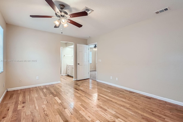 9802 N Military Trl, Palm Beach Gardens, FL 33410 - unfurnished room featuring ceiling fan, light wood-style floors, and baseboards