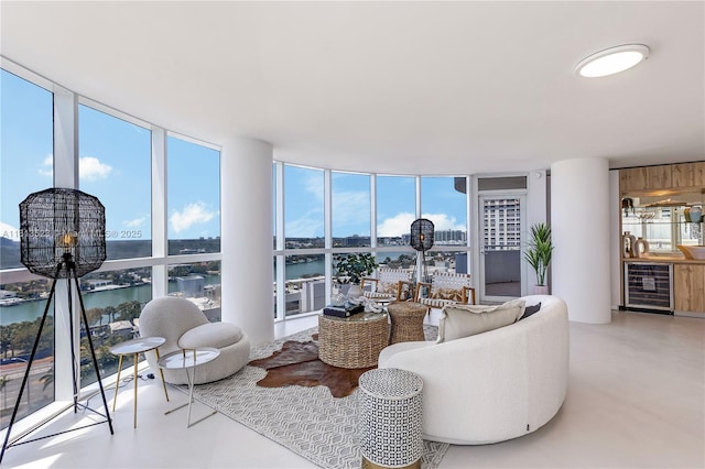 6301 Collins Ave Unit 1405, Miami Beach, FL 33141 - living area with beverage cooler, a wall of windows, healthy amount of natural light, and a water view
