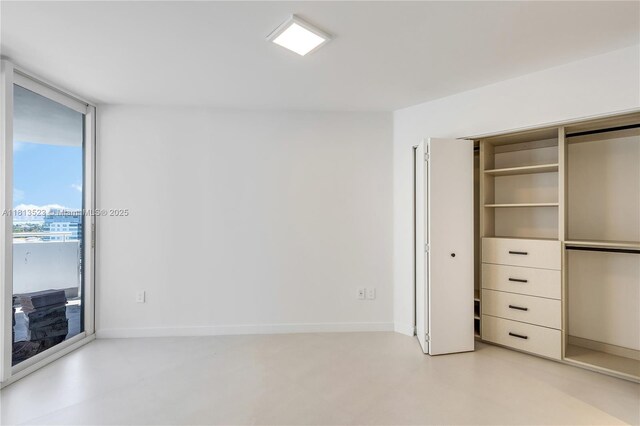6301 Collins Ave Unit 1405, Miami Beach, FL 33141 - unfurnished bedroom featuring access to exterior and a closet