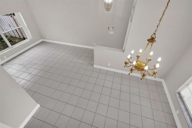 495 SW 183rd Way, Pembroke Pines, FL 33029 - spare room featuring light tile patterned floors, baseboards, and a chandelier