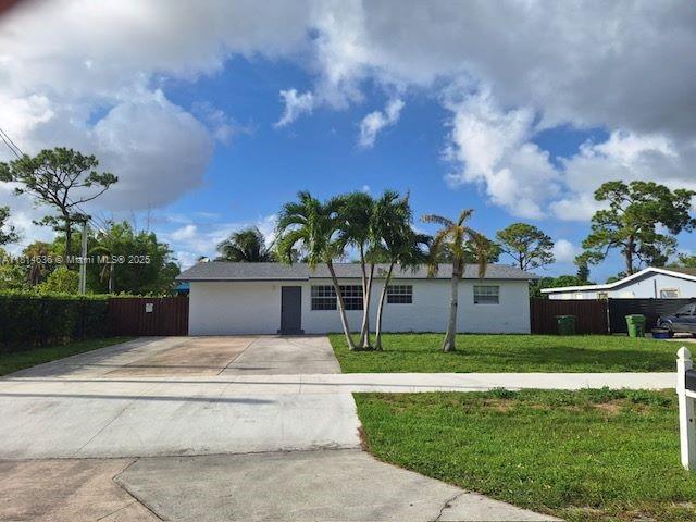 3961 Park Ln, Palm Springs, FL 33406 - single story home featuring concrete driveway