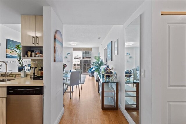 1250 S Miami Ave Unit 2208, Miami, FL 33130 - kitchen with dishwasher, modern cabinets, light countertops, and light brown cabinets