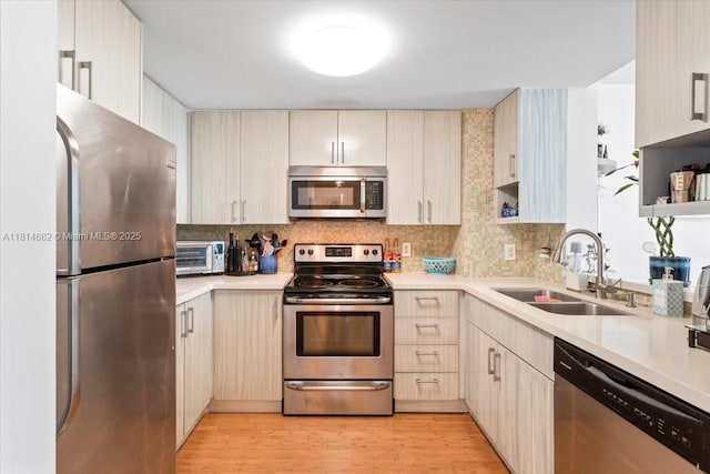 1250 S Miami Ave Unit 2208, Miami, FL 33130 - kitchen featuring stainless steel appliances, a sink, light countertops, and tasteful backsplash
