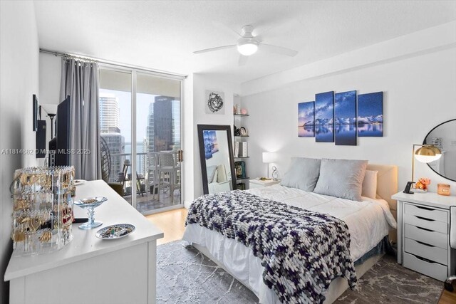 1250 S Miami Ave Unit 2208, Miami, FL 33130 - bedroom featuring access to exterior, ceiling fan, and wood finished floors